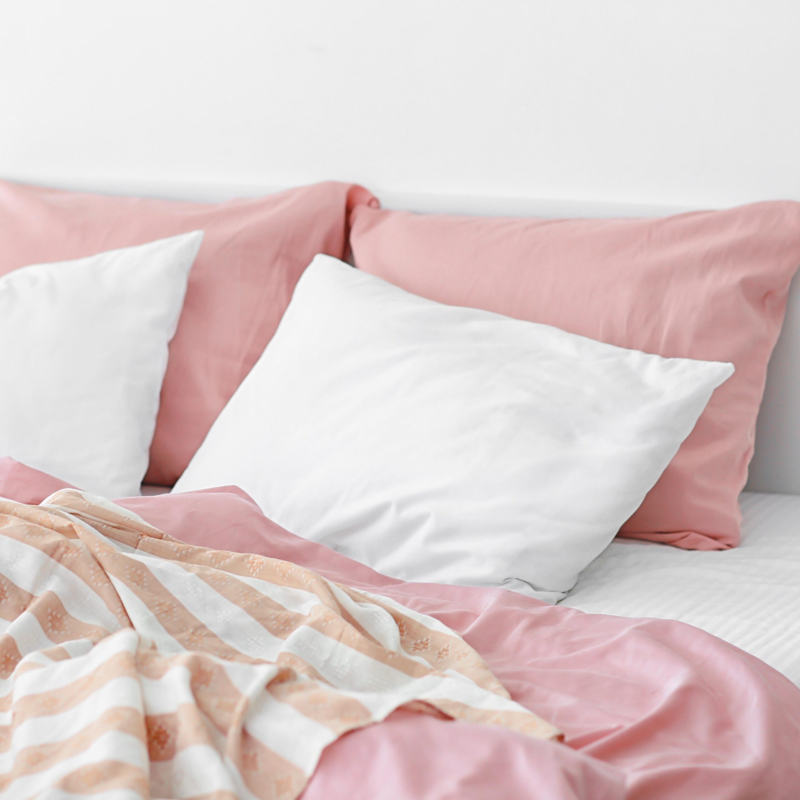 Cozy modern bed with soft pillows